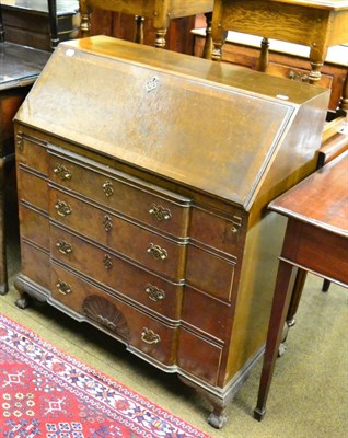 Lot 1313 - An early 20th century oak bureau