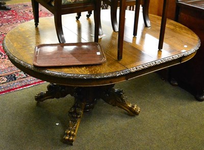 Lot 1327 - Carved oak pedestal table with leaf