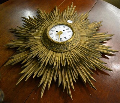 Lot 1337 - A gilt wood sunburst wall clock with modern battery movement