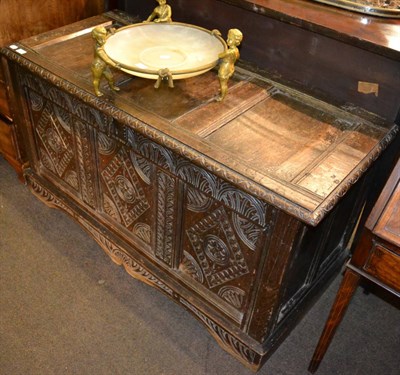 Lot 1339 - An 18th century carved oak three panel coffer