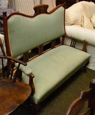 Lot 1349 - A carved oak two seater sofa