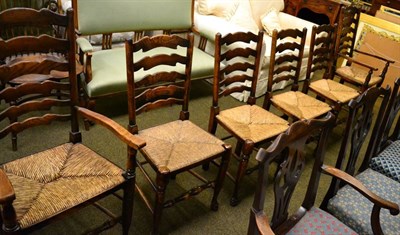 Lot 1351 - Four ladder back rush seated chairs and two carvers (6)