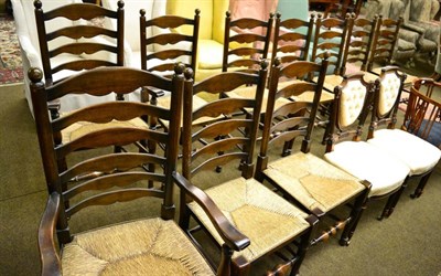 Lot 1368 - Eight ladder back rush seated chairs and two carvers (10)