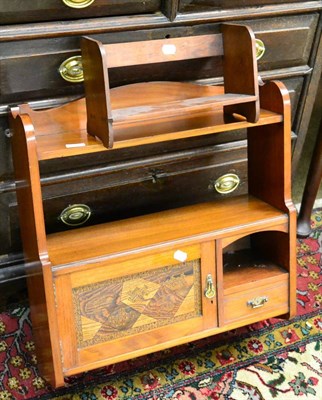 Lot 1371 - An aesthetic period walnut wall cupboard with Japanese parquetry panel door and small mahogany book