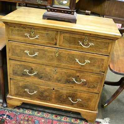 Lot 1375 - A walnut chest of drawers