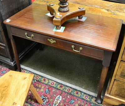 Lot 1377 - A 18th century mahogany side table on pad feet