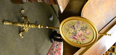 Lot 1384 - A gilded fire pole screen, with floral tapestry inset