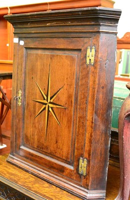 Lot 1398 - George III inlaid oak hanging corner cupboard (a.f.)