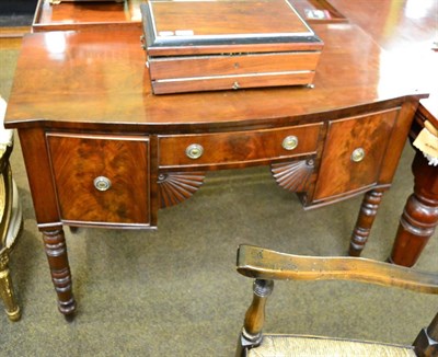 Lot 1414 - A 19th century mahogany bow fronted sideboard of small proportions