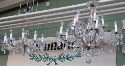 Lot 1429 - A Georgian style twelve light chandelier together with a similar ten light example (2)