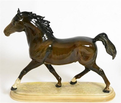 Lot 120 - Beswick Arab Stallion, trotting, model No. 2242, on pottery base, brown gloss