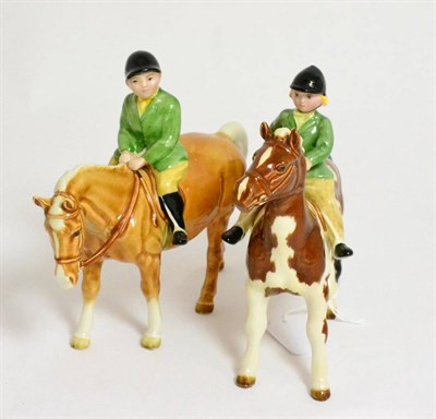 Lot 143 - Beswick Girl On Pony, model No. 1499 and Boy On Pony, model No. 1500, palomino gloss (a.f.)