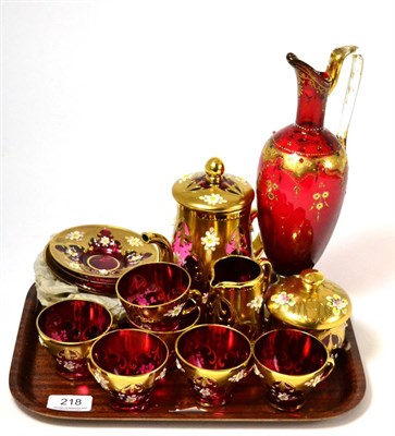 Lot 218 - A gilt cranberry coffee service and a ewer