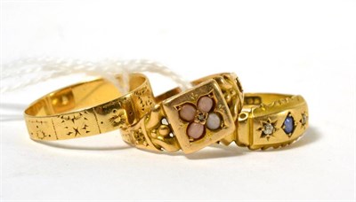 Lot 271 - A coral set ring, an 18ct gold sapphire and diamond ring and an 18ct gold band ring