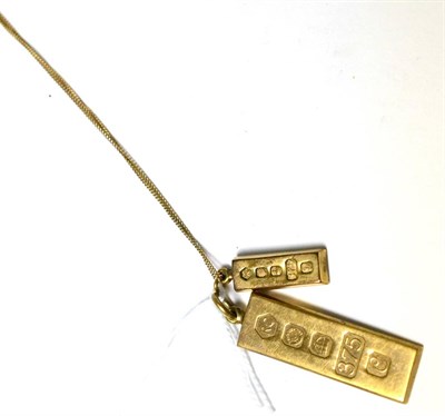 Lot 289 - Two 9ct gold ingot pendants