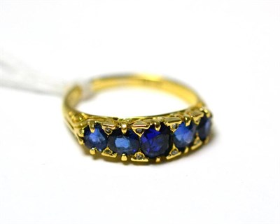 Lot 294 - A five stone sapphire ring, stamped ";18K"