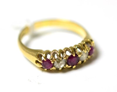 Lot 296 - A diamond and ruby five stone ring, stamped 18k