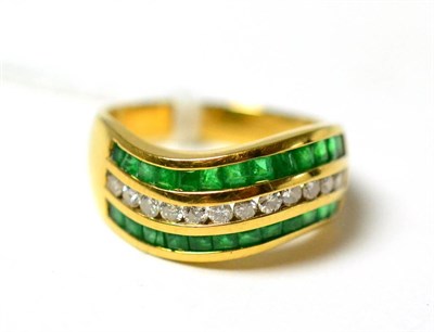 Lot 297 - An emerald and diamond ring, stamped 18k