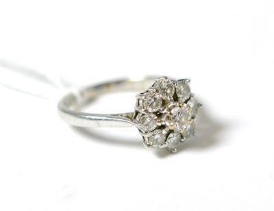 Lot 313 - An 18ct white gold diamond nine stone cluster ring, total estimated diamond weight 1.00 carat