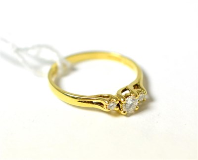 Lot 315 - A 18ct gold diamond three stone ring