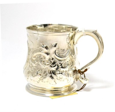 Lot 327 - A George II silver mug, London 1729 (later decorated and repaired)