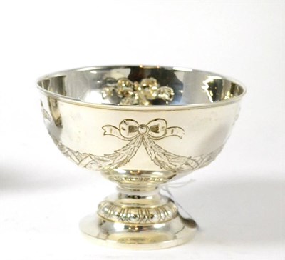 Lot 329 - A silver bowl chased with garlands of flowers, London 1900