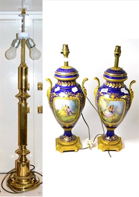 Lot 357 - ~A pair of Sevres style porcelain lamp bases and another lamp (3)