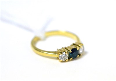 Lot 382 - A sapphire and diamond three stone ring, stamped 750