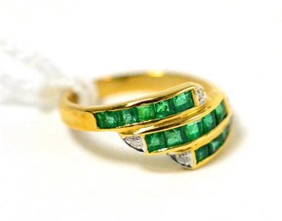 Lot 383 - ~An emerald and diamond ring, stamped 750