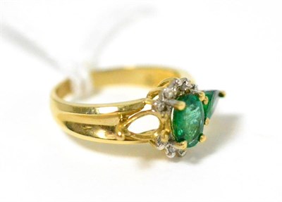 Lot 385 - ~An emerald ring, one emerald missing