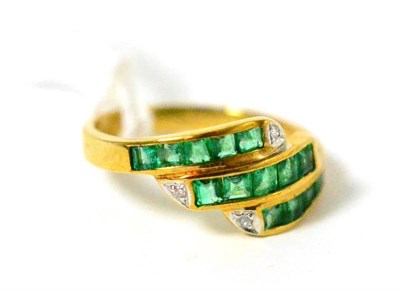 Lot 399 - ~An emerald and diamond ring, stamped 750