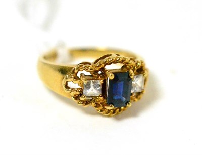 Lot 409 - ~A synthetic sapphire and paste three stone ring