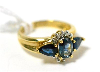 Lot 423 - ~A sapphire and diamond ring, stamped 14K