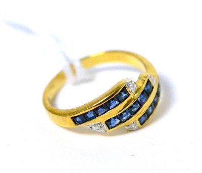 Lot 427 - ~A sapphire and diamond ring, stamped 750