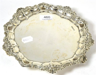 Lot 460 - Silver salver, with shaped rim decorated with scrolls, raised on three feet