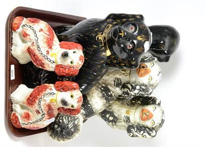 Lot 464 - A pair of Staffordshire spaniels, a smaller pair and a pair of Whieldon style black glazed dogs