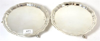 Lot 471 - A pair of silver salvers on ball and claw feet