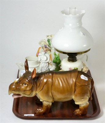 Lot 480 - A Continental porcelain model of a rhino, a porcelain oil lamp base etc