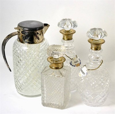 Lot 536 - A pair of silver mounted mallet decanters with stoppers, silver mounted square decanter with...