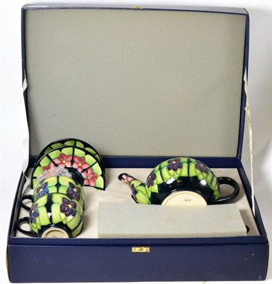 Lot 546 - Moorcroft pottery Violet pattern part morning tea set, boxed