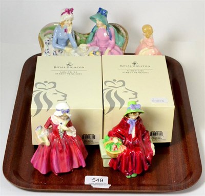 Lot 549 - Six various Doulton pottery figures including afternoon tea, two miniature street vendors in...