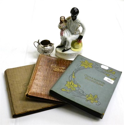 Lot 563 - Staffordshire flatback figure, Uncle Tom and Eva; Burmese silver jug and three albums of...