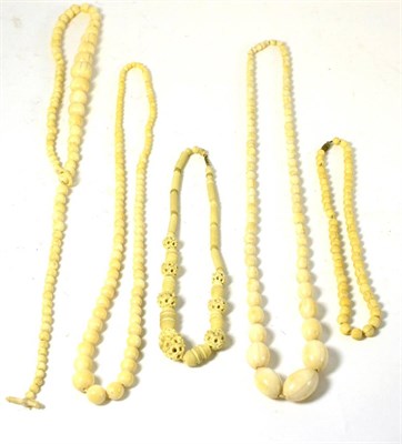 Lot 573 - Five late 19th/early 20th century ivory bead necklaces