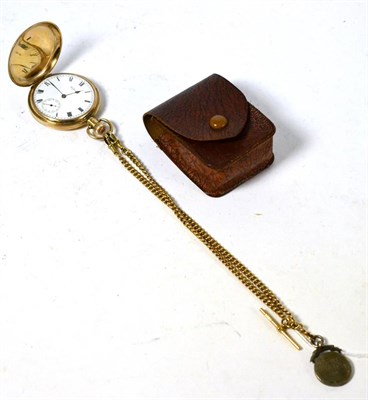 Lot 579 - A 9ct gold Waltham pocket watch, an Albert chain, stamped '9.375' with silver shield fob