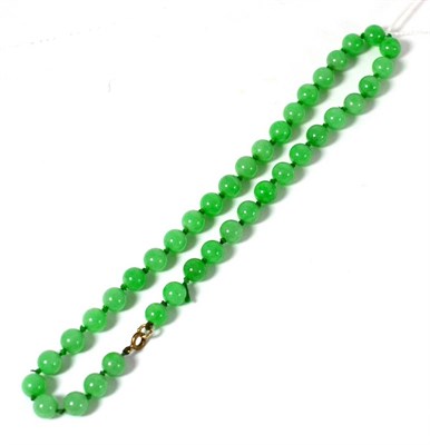 Lot 594 - A jade bead necklace