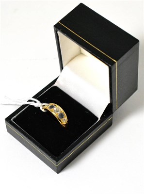 Lot 603 - An 18ct gold diamond and sapphire ring