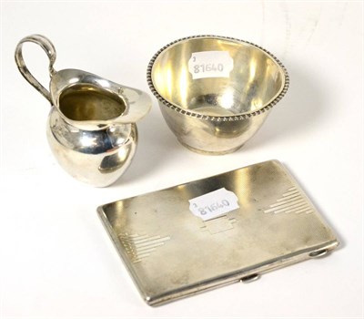 Lot 604 - Silver comprising a cigarette case, circular bowl and a small jug