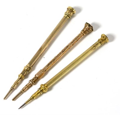 Lot 609 - A gold propelling pencil and two others