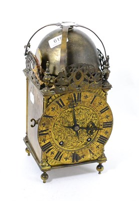 Lot 615 - A lantern type clock with a quarter striking movement