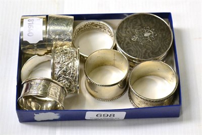 Lot 698 - Seven silver and one plated napkin rings and a silver and tortoiseshell box